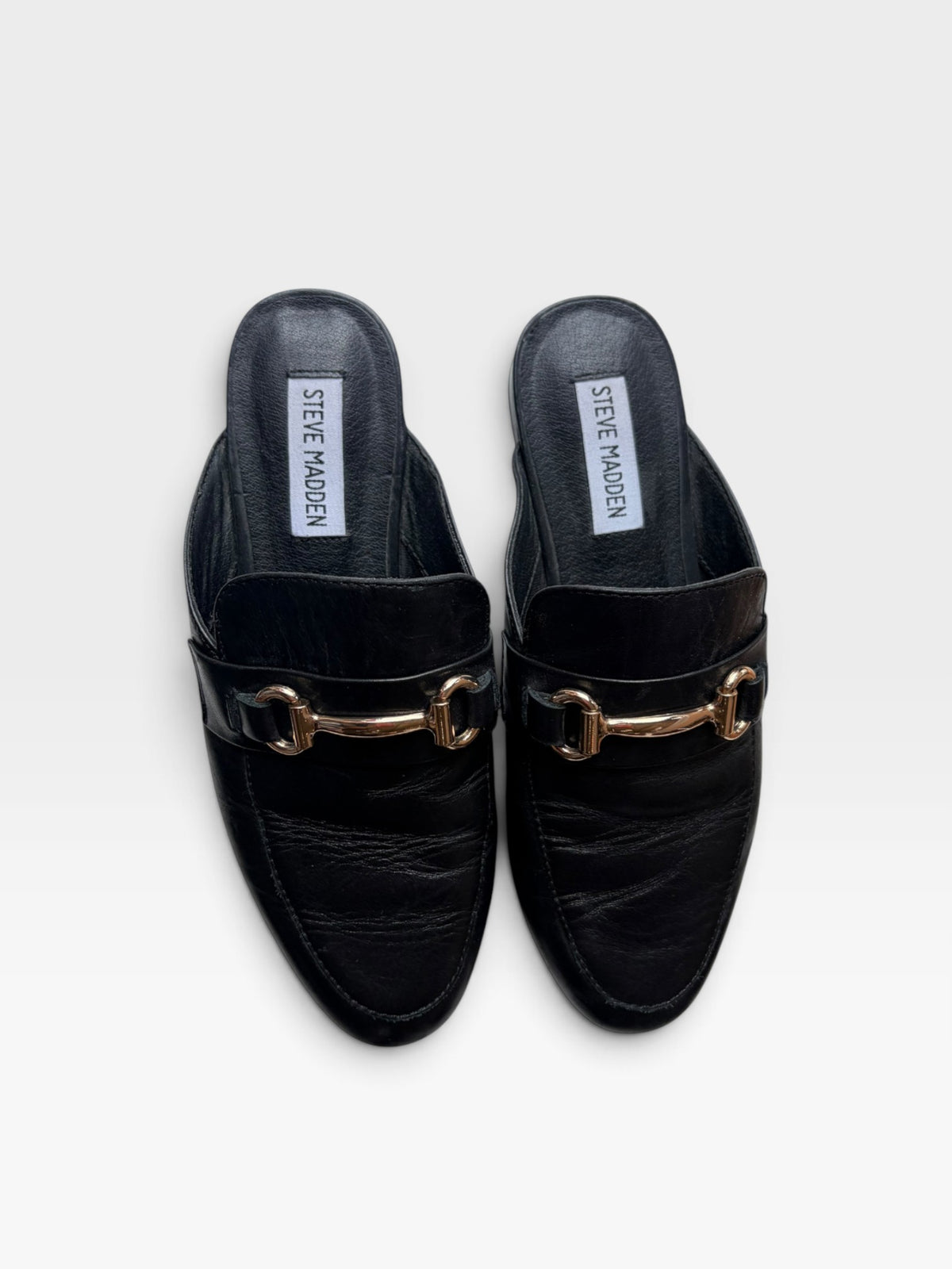 TheConsignmentBar Steve Madden black leather slip-on loafers with gold-tone horsebit hardware