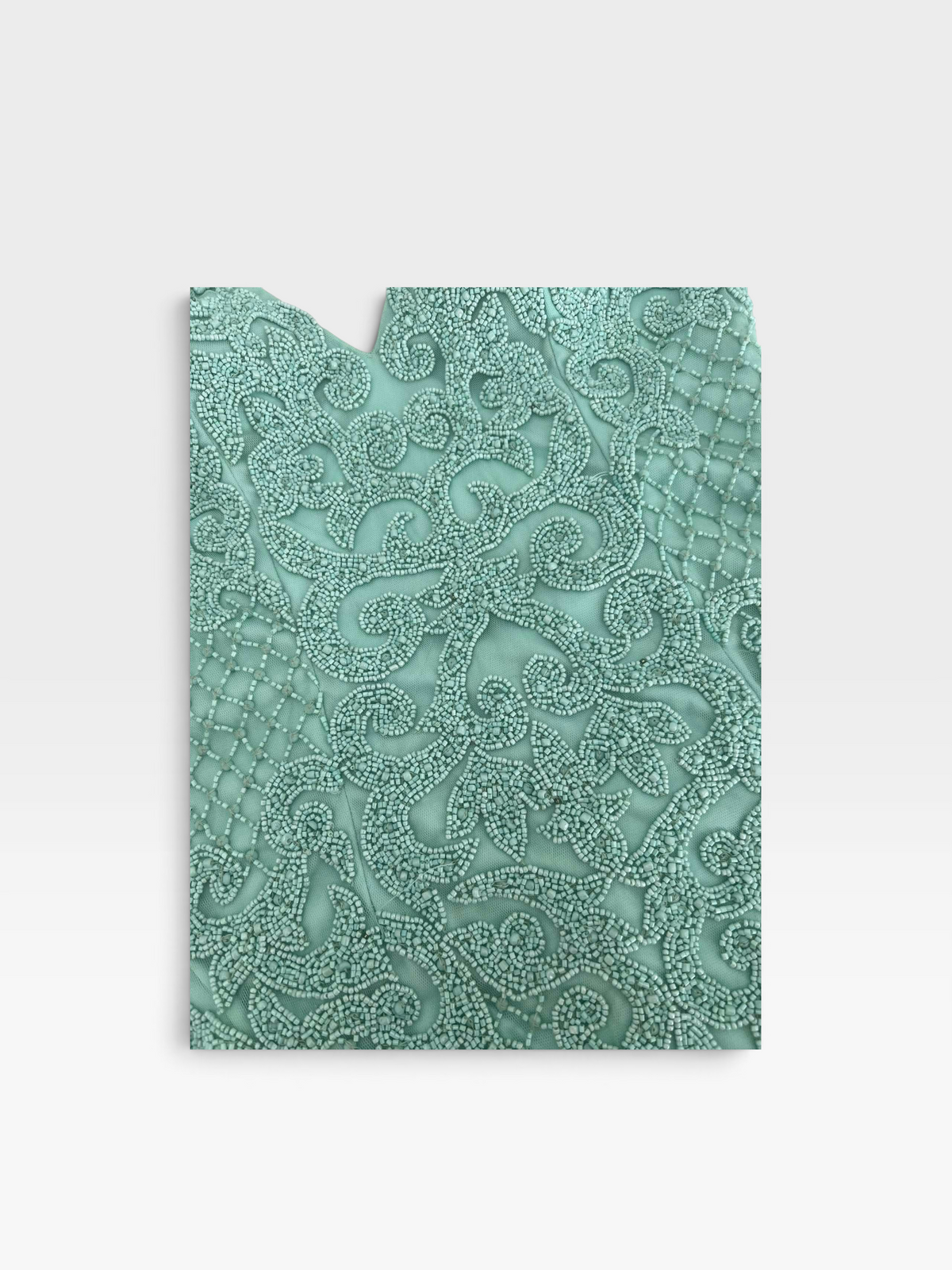 TheConsignmentBar Primavera teal dress featuring intricate tonal beadwork in an ornate swirling floral pattern