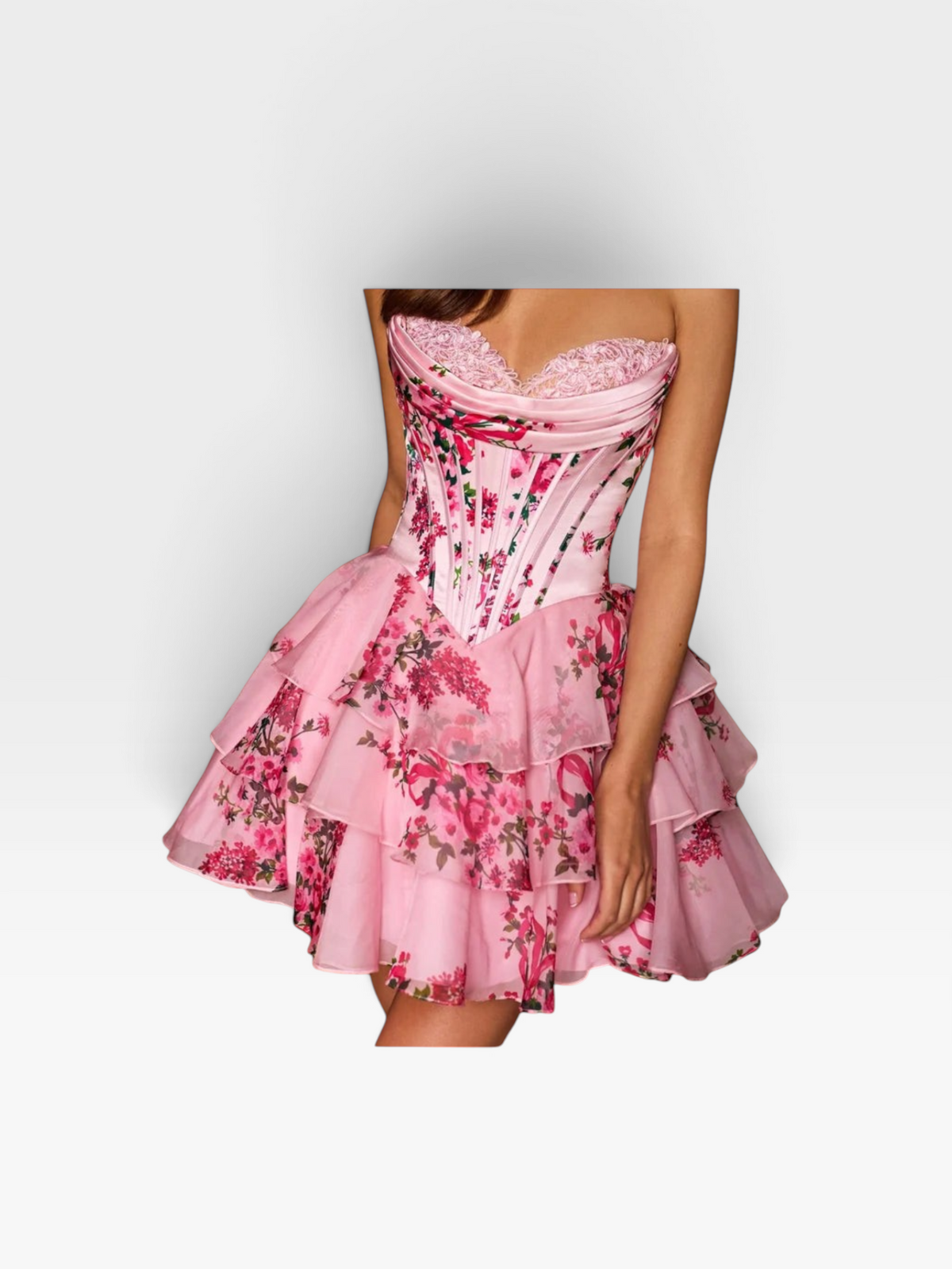 TheConsignmentBar Sherri Hill pink floral corset dress with a ruffled skirt and sweetheart neckline on a model.