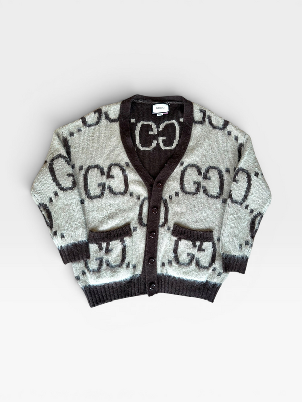 TheConsignmentBar brown and tan knit cardigan with repeating logo pattern, V-neck, and front pockets, size M.