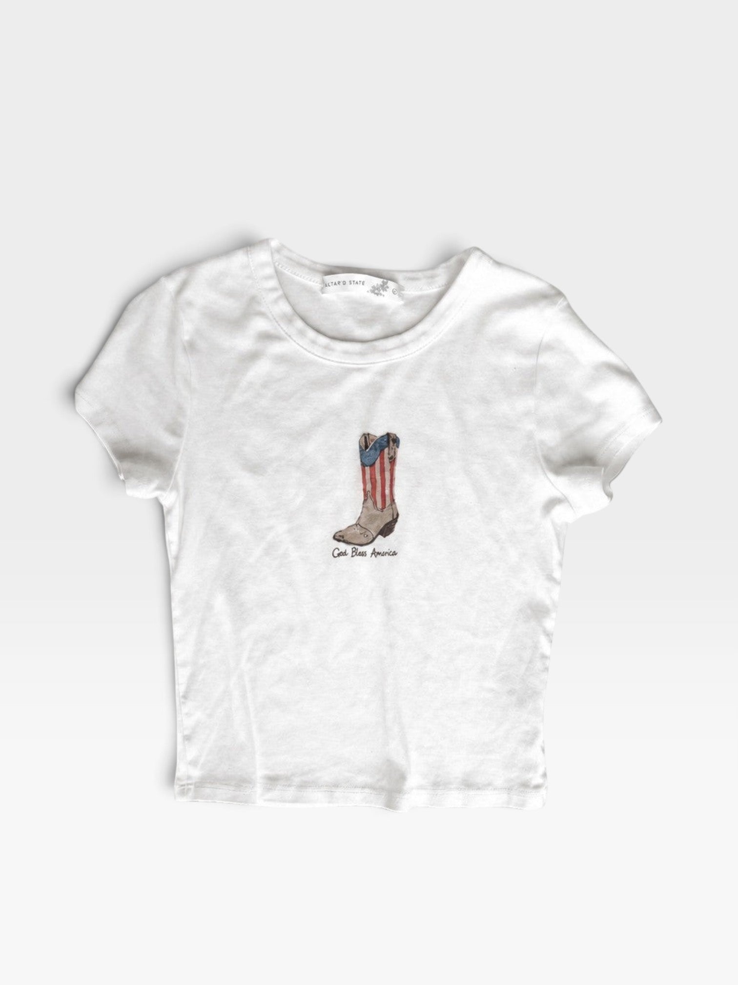 TheConsignmentBar white Altard State t-shirt featuring a graphic of a cowboy boot with American flag stripes