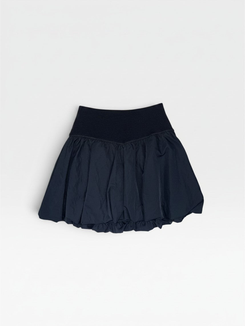 TheConsignmentBar black Offline skort with a wide elastic waistband and a voluminous bubble hem silhouette.