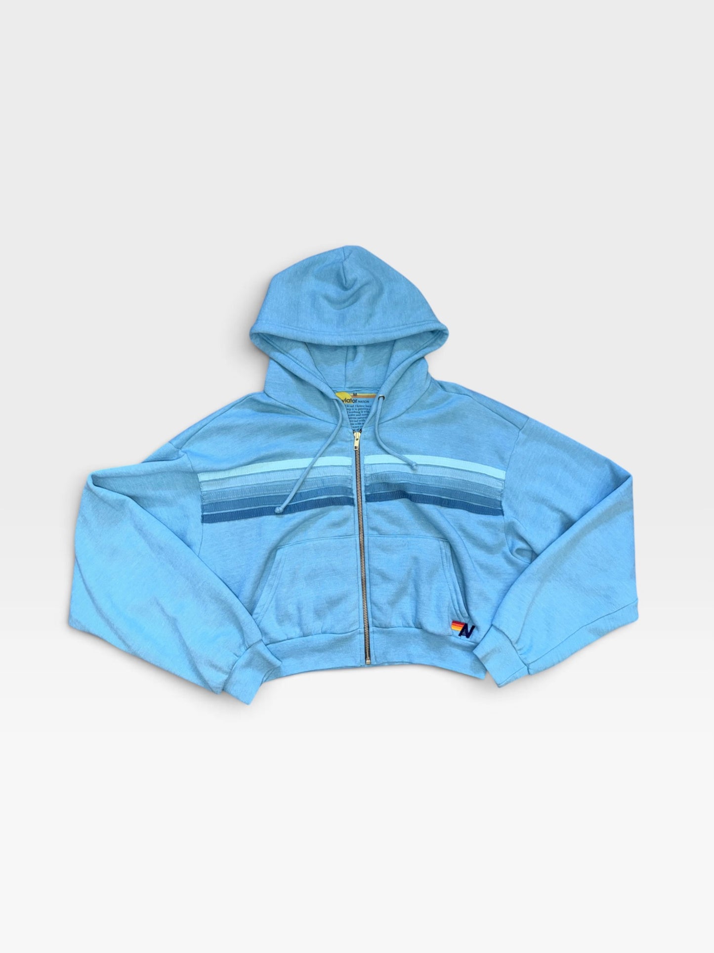 TheConsignmentBar blue Aviator Nation zip-up hoodie featuring horizontal striped chest detail and a small logo patch.