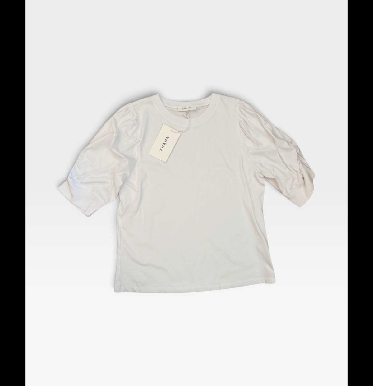 TheConsignmentBar Frame white Frankie tee with puff sleeves and original tags attached in size XL.