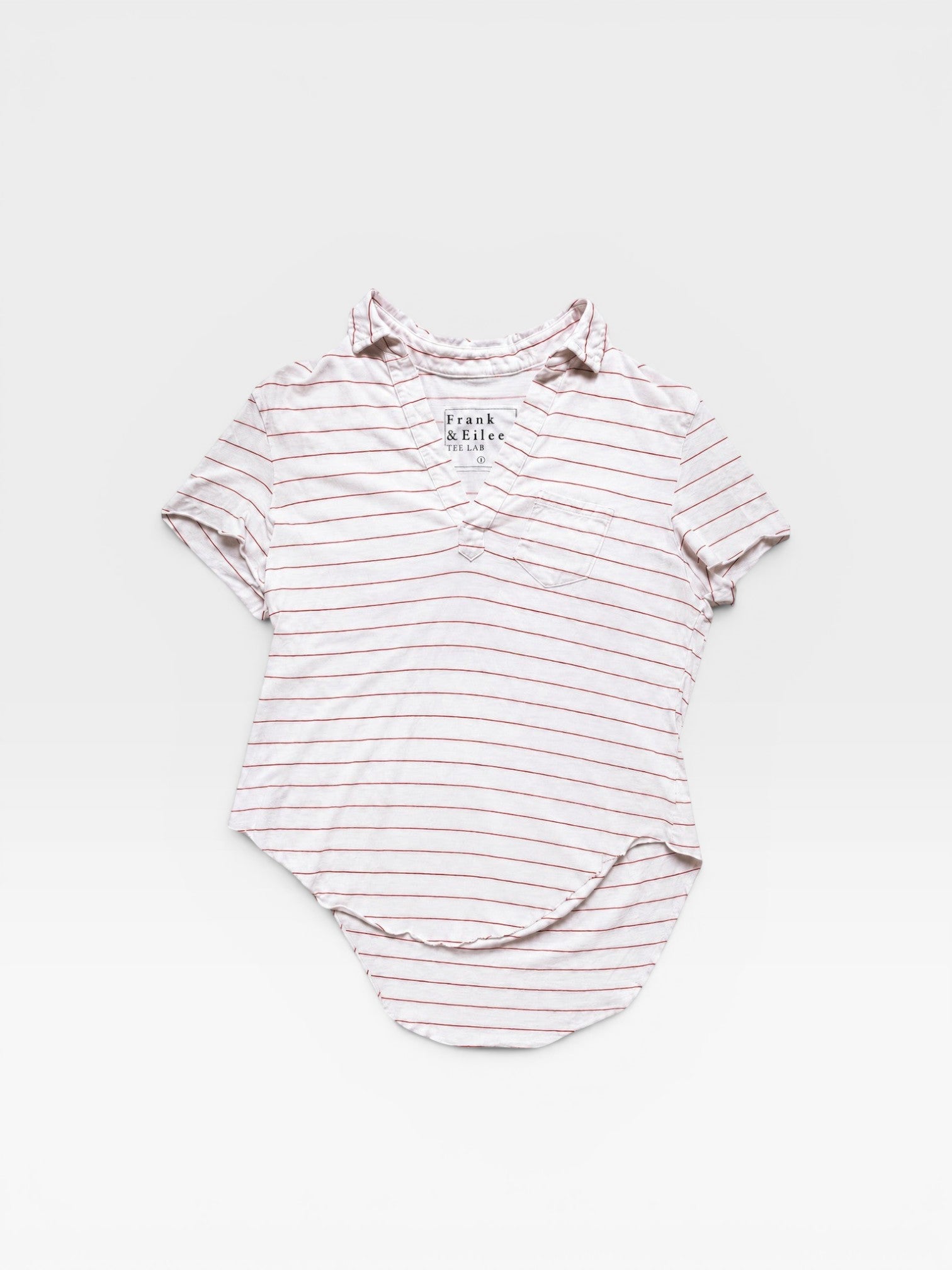 TheConsignmentBar Frank & Eileen white and red striped V-neck top with a chest pocket and curved hem.