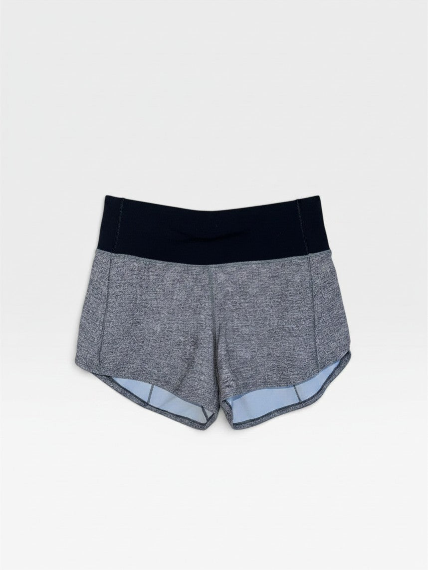 TheConsignmentBar Lululemon gray athletic shorts with a high black waistband and moisture-wicking fabric.