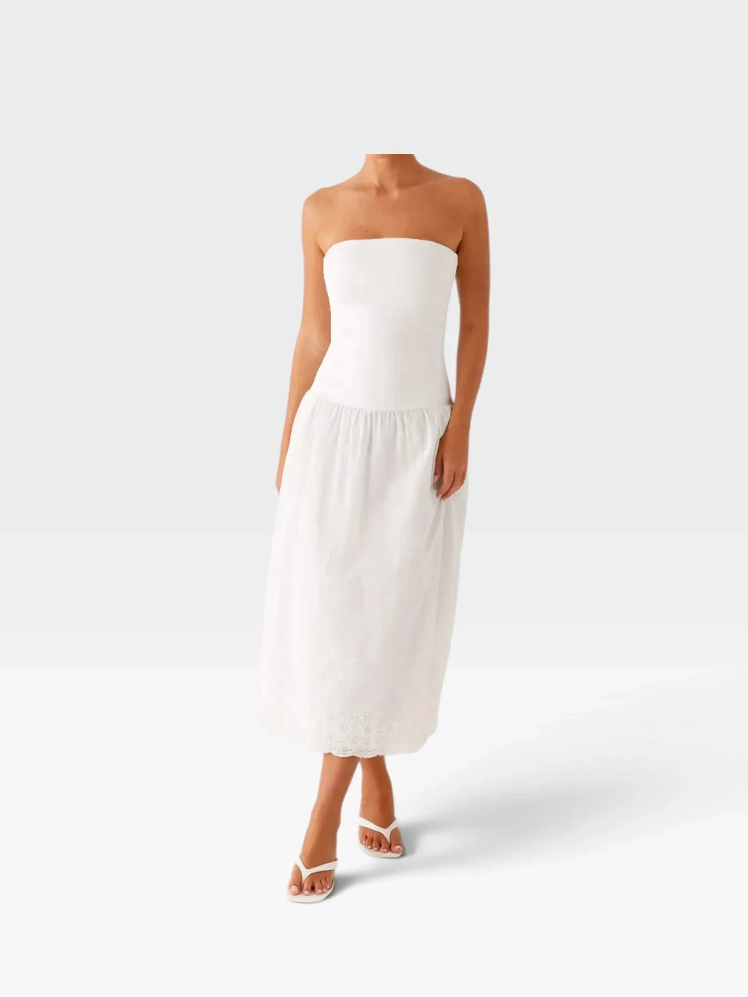 TheConsignmentBar PEPPERMAYO white strapless midi dress with a fitted bodice and embroidered hem detail