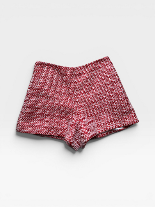 TheConsignmentBar red and white textured tweed high-waisted shorts with a tailored fit.