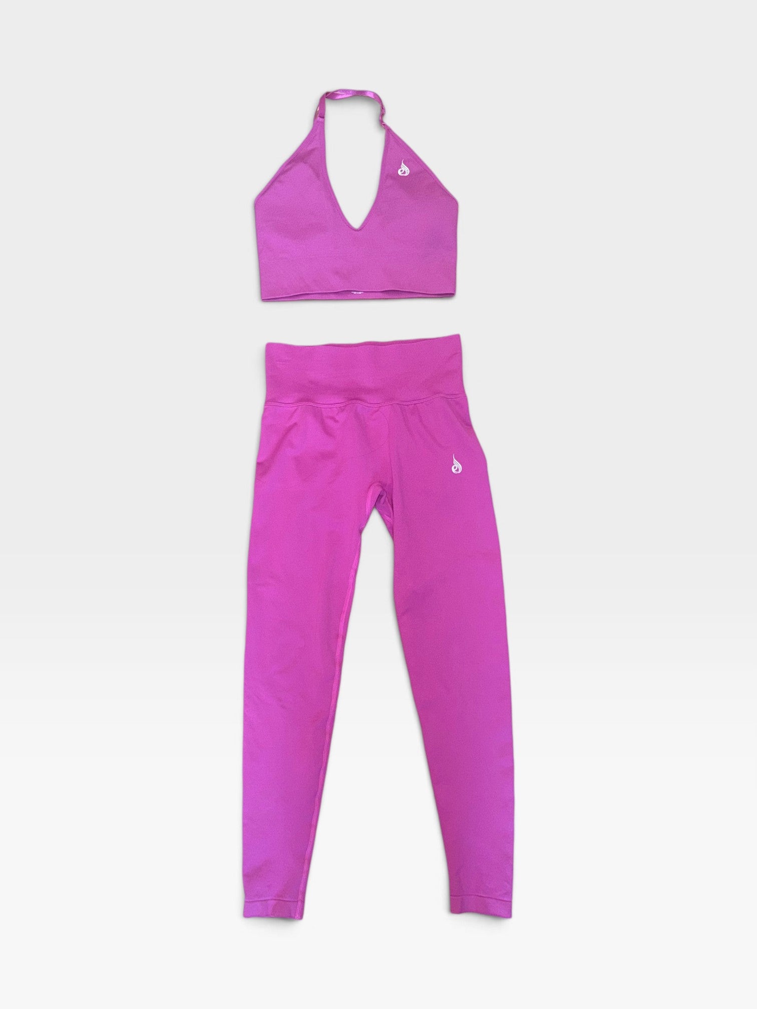 TheConsignmentBar RYDERWEAR matching sets in blue and pink featuring halter sports bras and high-waisted leggings.