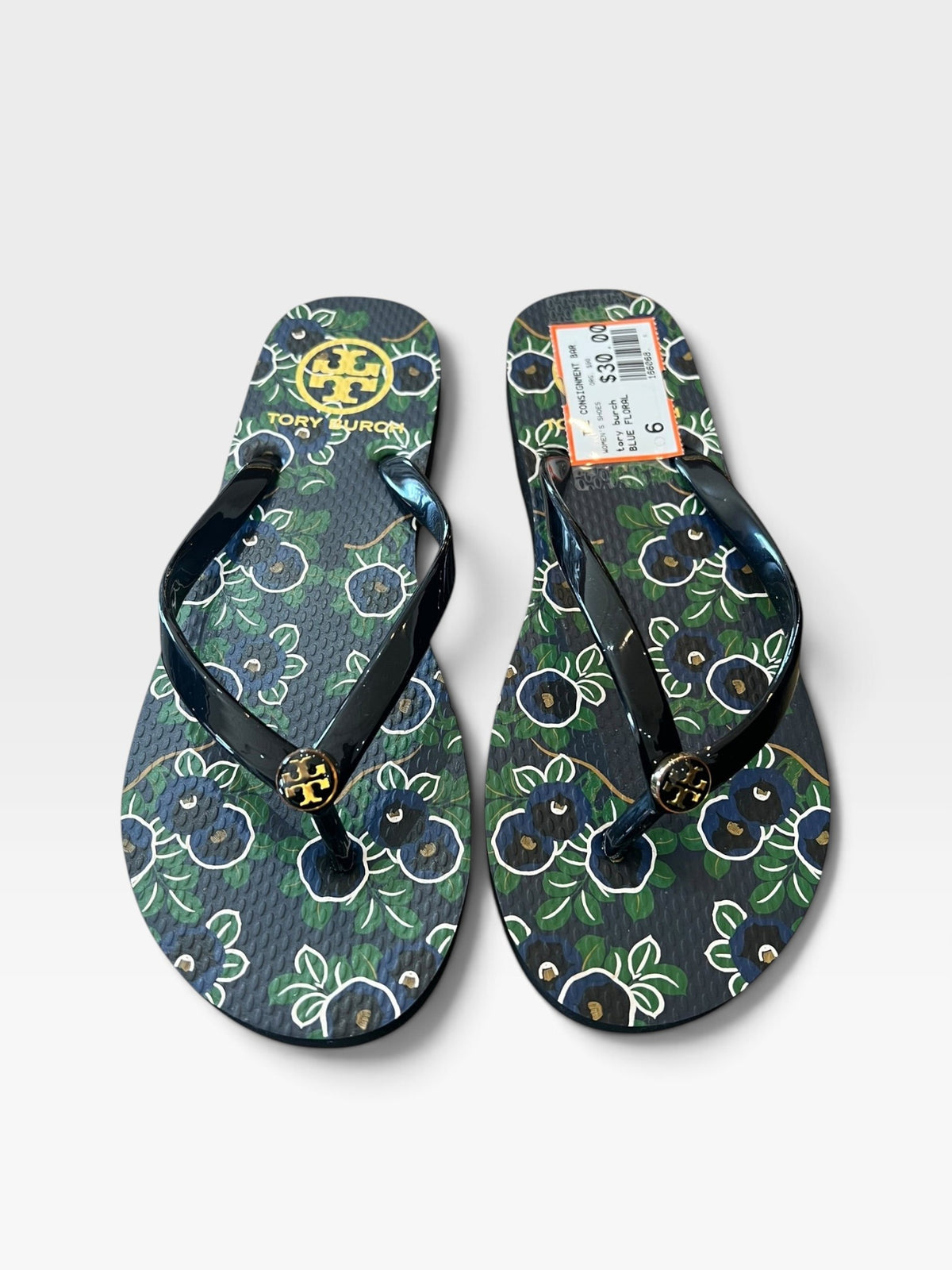 TheConsignmentBar Tory Burch blue floral flip flops with gold logo emblem on black rubber straps, size 6
