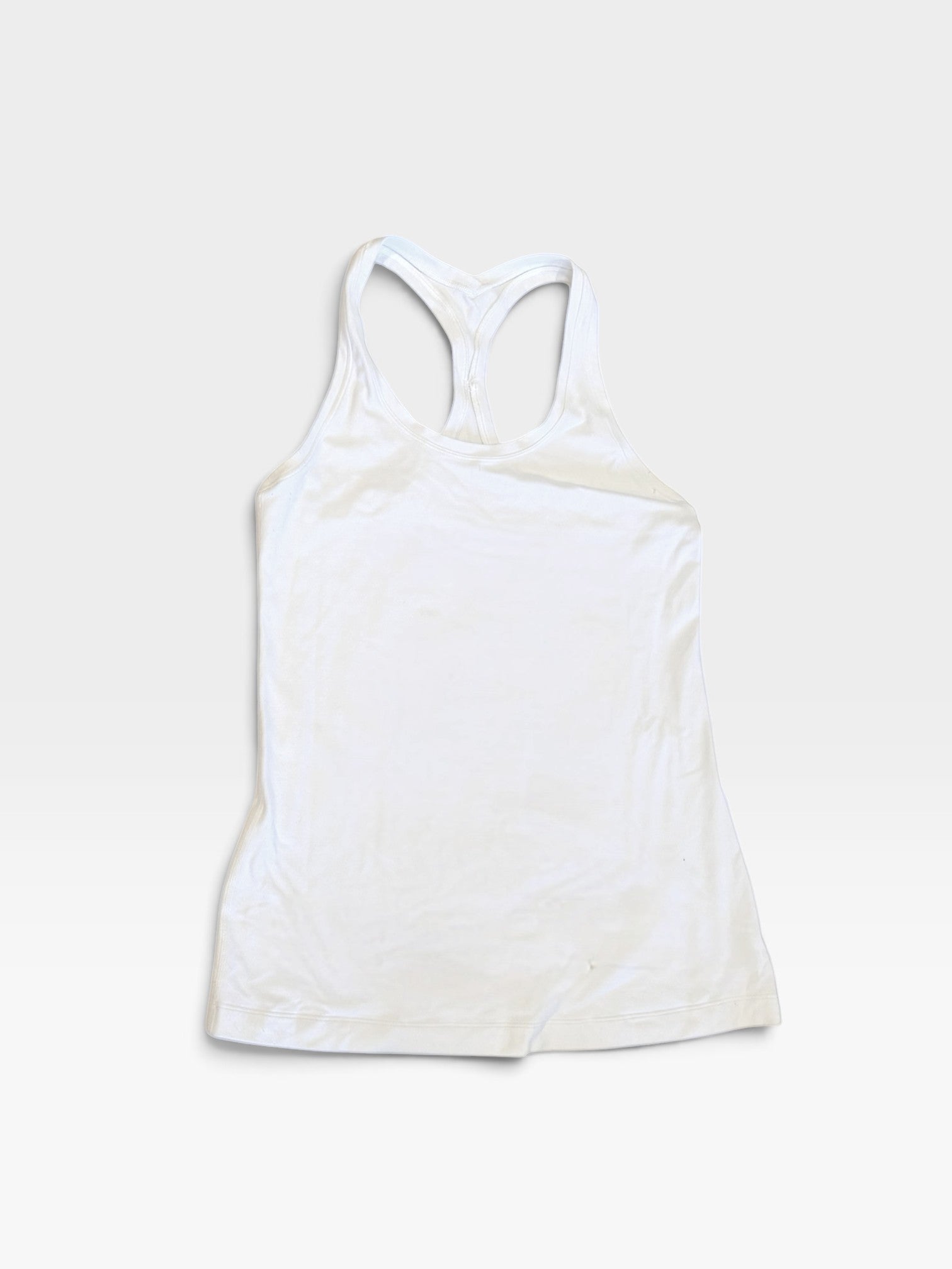 TheConsignmentBar white Lululemon racerback tank top in size 10, featuring a lightweight athletic design.