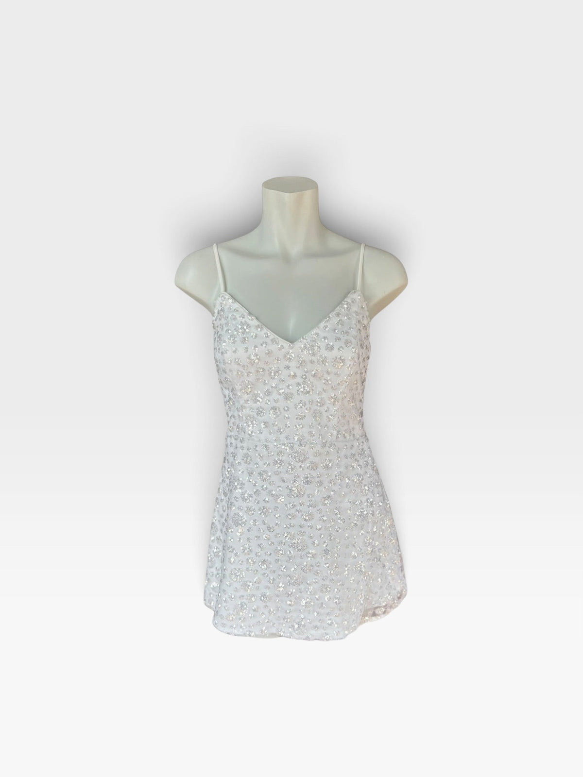 TheConsignmentBar white Lulus camisole top featuring delicate silver sequin embellishments and thin spaghetti straps.