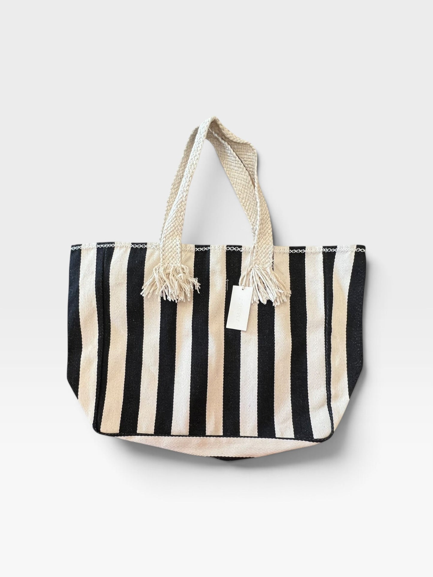 TheConsignmentBar Z Supply black and cream striped canvas tote bag with braided rope handles and tassel details.